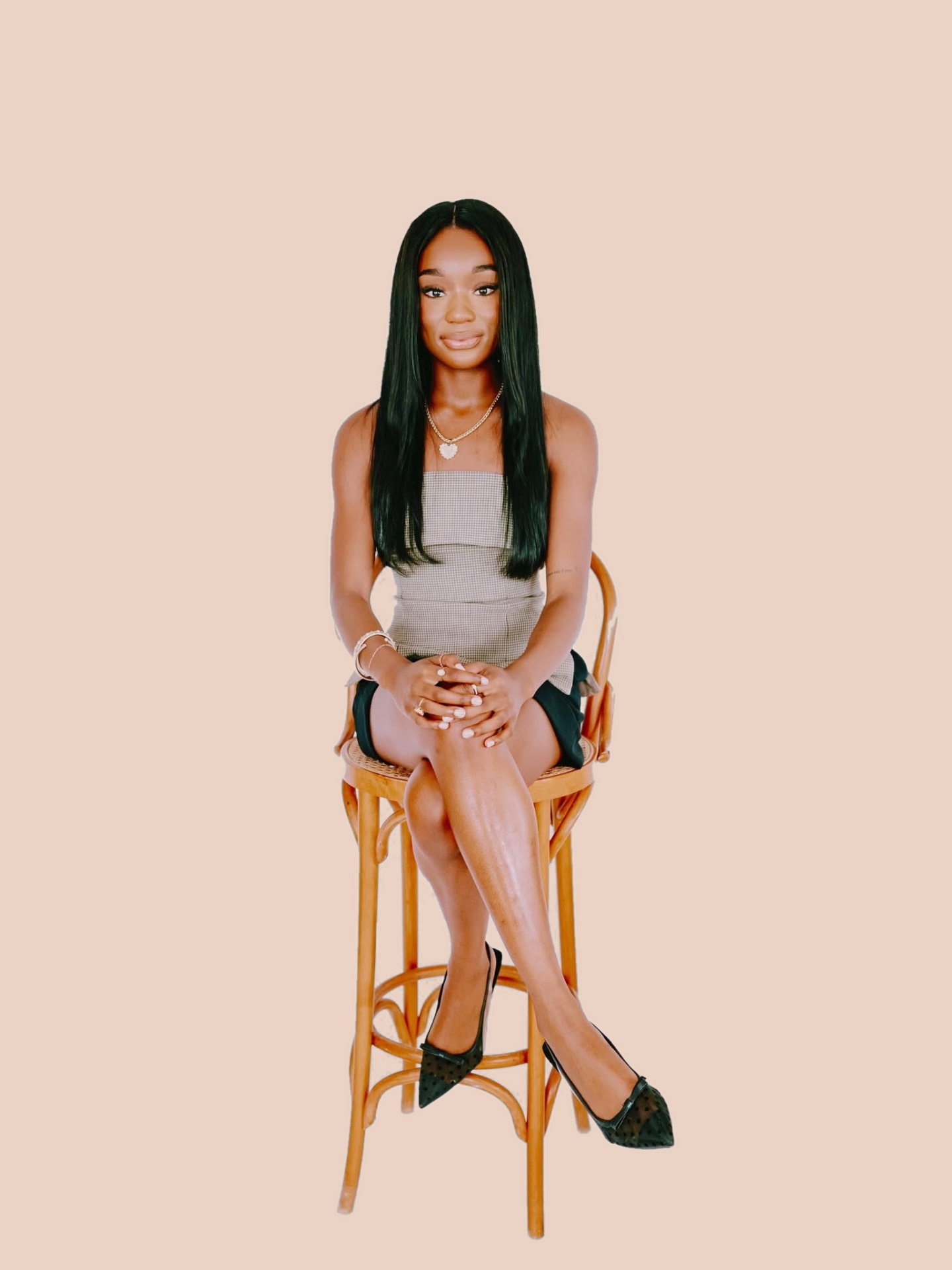 Attiya Smith seated on a stool