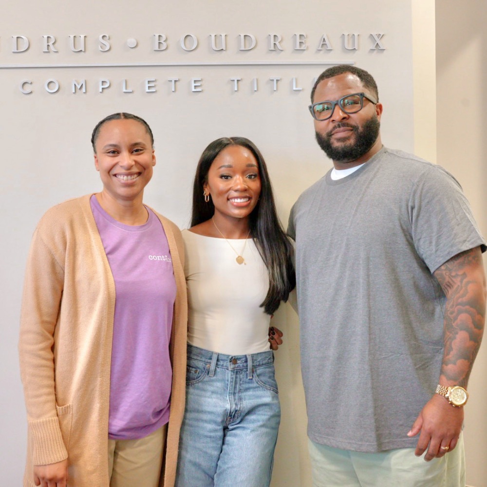 Attiya Smith with clients after a closing