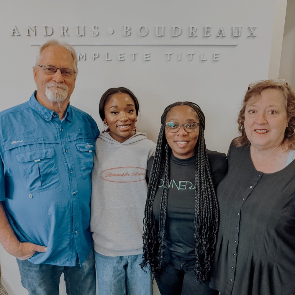Attiya Smith with a family after a closing